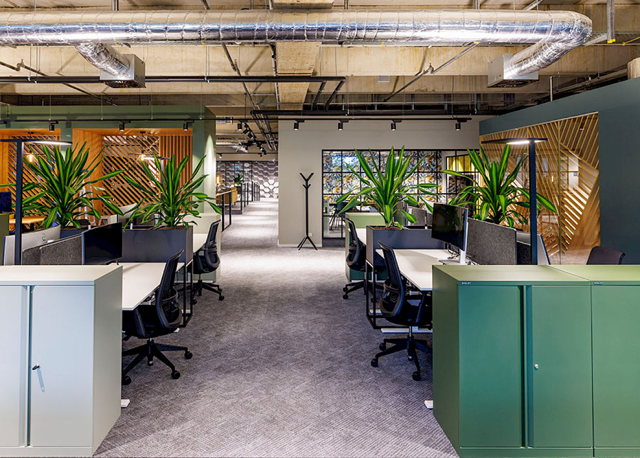 Redesigned open-space workplaces of the IT Arena.