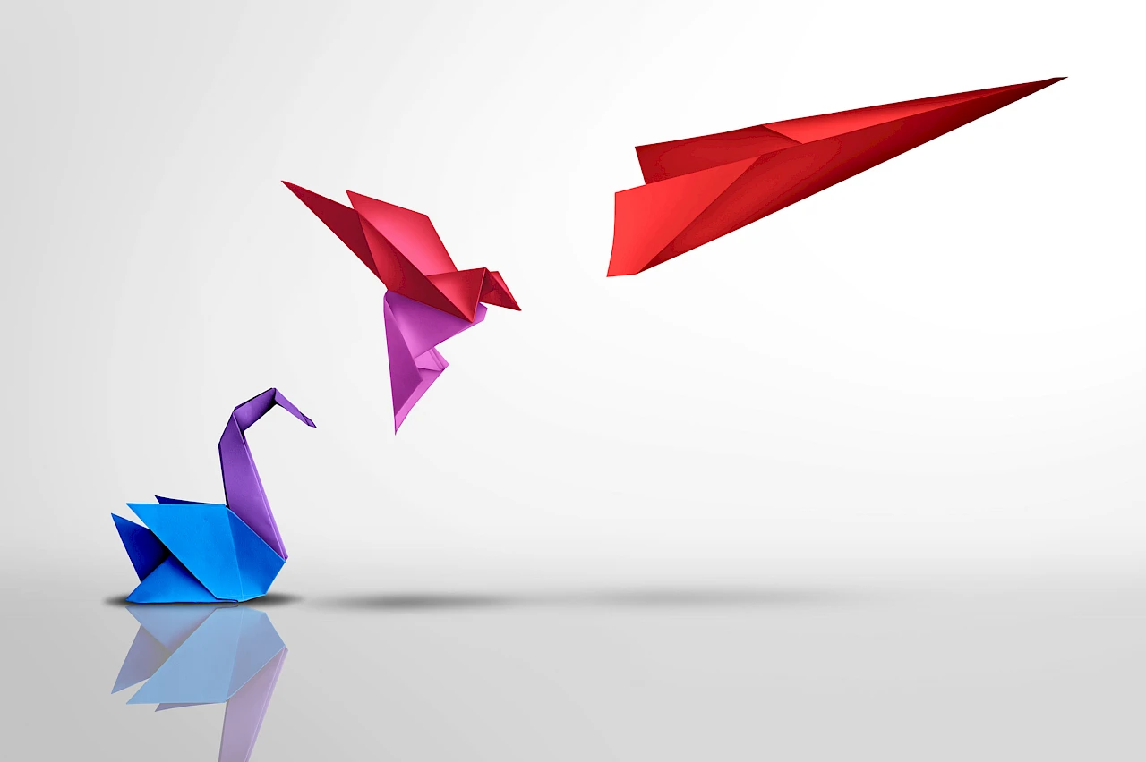 Bild mit Papiervögeln, das für Transformation und Erfolg steht. Quelle: https://www.istockphoto.com/de/foto/transformieren-und-erfolgreich-sein-gm1473750158-503805386