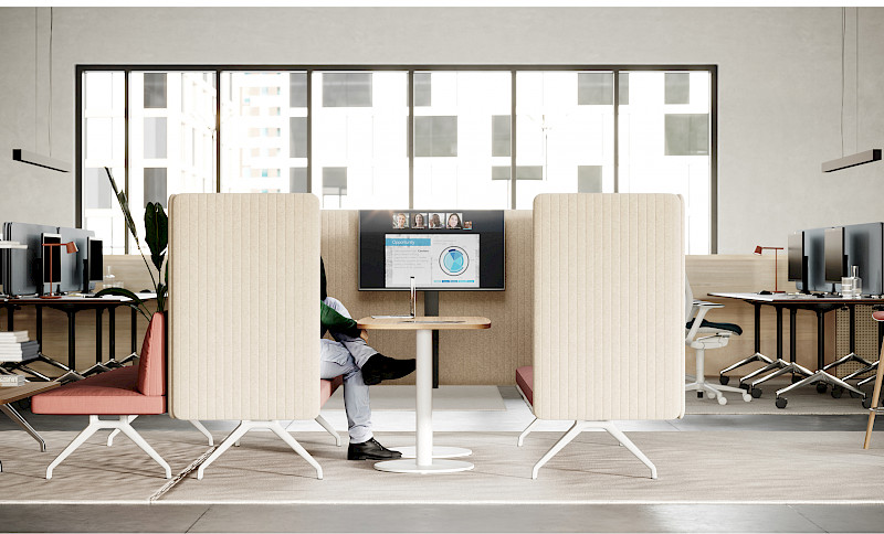 A screened-off pod for people to retreat to and hybrid collaboration in the office.